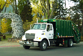 Westbank Sanitation rear load garbage truck.