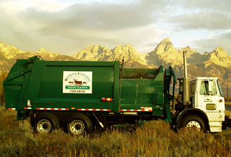 Westbank Sanitation rear load garbage truck.